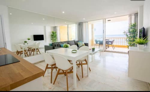 Modern 1-bedroom apartment in Arguineguín with sea view, dining area, living room, and ocean-view balcony