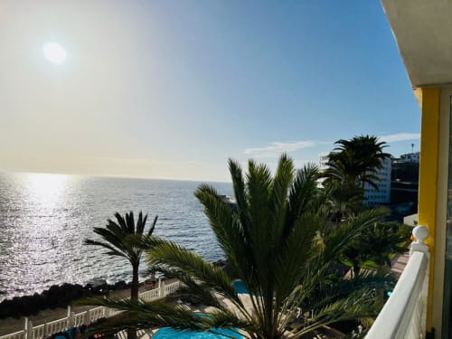 Studio apartment sea view in Arguineguín with ocean, palm trees, and balcony overlooking the coast