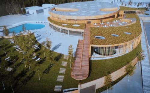Vue aérienne du Fassardy avec bâtiment courbe en bois, jardin sur le toit, piscine et aménagement paysager à Châteauroux