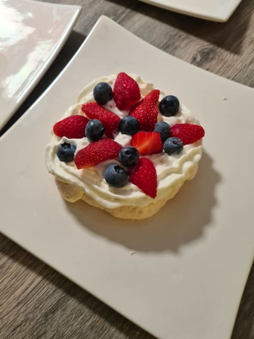 Elegant berry tart with cream at Domaine de l'Oie Rouge, Loire Valley bed and breakfast