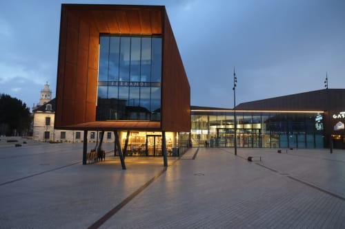 Modern Ferrandi building at twilight in Saint-Romain, France near Gites bo accommodation