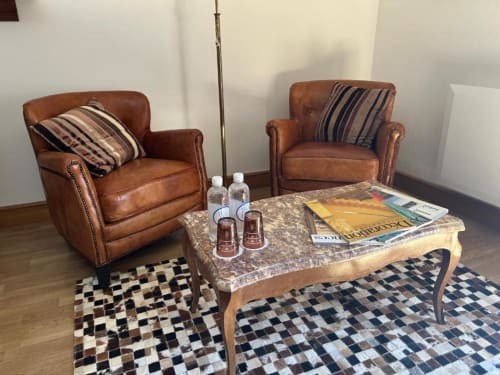 leather club chair by Saulaie