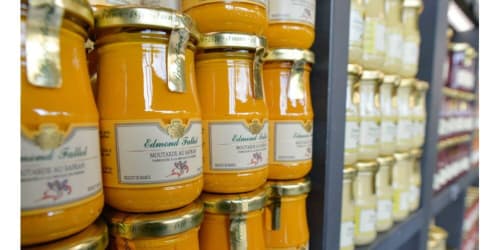 Artisanal Edmond Fallot mustard jars displayed at Gites bo, a charming bed and breakfast in Saint-Romain, France
