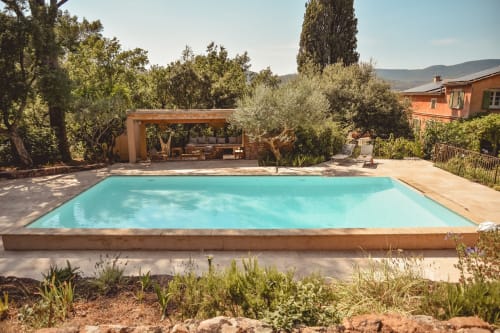 Terrace, pool house, stone wall, Provençal farmhouse, villa in Provence, Provencal basin, infinity pool, secure swimming pool, protective barrier, agapanthus, lavender, rosemary, Provençal cipress, Florence cipress, Mediterranean vegetation
