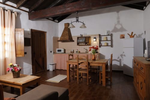 Rustic cottage kitchen and dining area in El Teide room at Casonas de Marengo, Icod de los Vinos, with wooden beams and