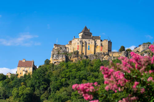 Medieval castle perched on rocky cliff near Domaine De Campagnac in Carsac-Aillac, France