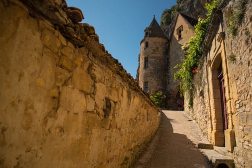 Medieval stone alley with tower at Domaine De Campagnac, a charming bed and breakfast in Carsac-Aillac, France