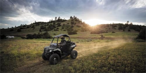 Black ATV on rolling green hills at Three Little Pigs hotel near Blandford Forum, UK