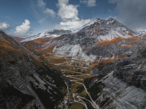 Scenic mountain valley with winding road near Vezza d'Oglio, Italy - alpine landscape view