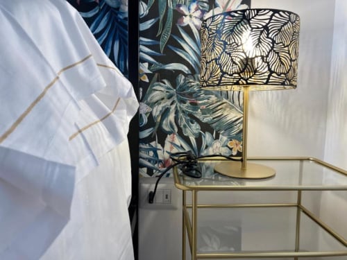 Modern bedside lamp with patterned shade in Talìa apartment at Noemi Holiday House, Agnone Bagni