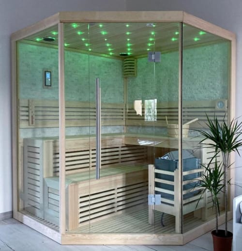 Modern glass sauna cabin with green-tiled walls, wooden benches, and LED ceiling lights at Noemi Holiday House in Agnone