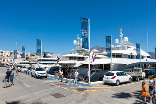 Puerto Banús marina with luxury yachts, waterfront apartments, and Mediterranean coastline in Marbella