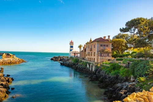 Embaixada da Vila beachfront mansion in Cascais with lighthouse and turquoise waters