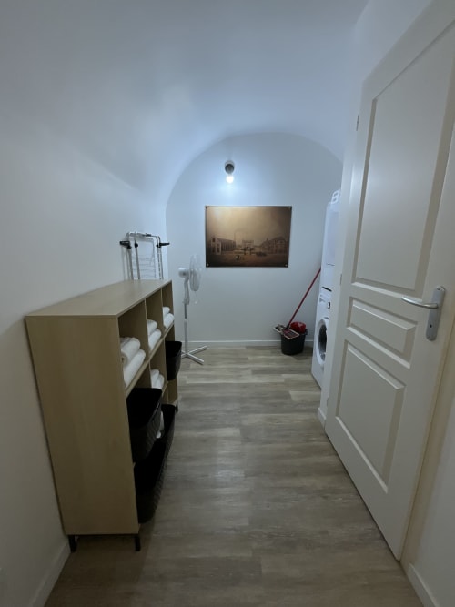 Modern laundry room in Locacharme Gîte Auguste Poulain cottage, Blois with storage shelves