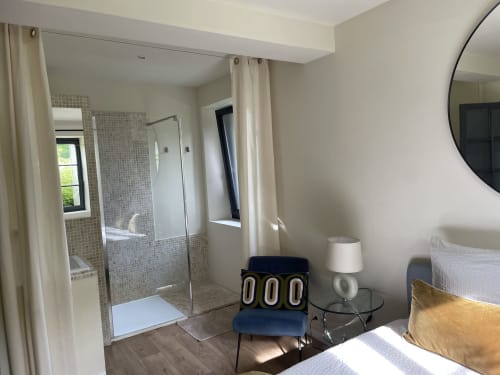 Modern bedroom with Italian shower enclosure and garden view at Clairseine boutique hotel, Tournedos-sur-Seine