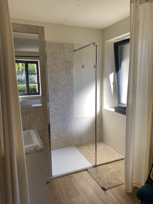 Modern Italian shower with glass partition and mosaic tiles in The Little Suite cottage at Clairseine BnB,