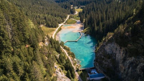 Stunning alpine lake surrounded by dense forests near Brides-les-Bains, France