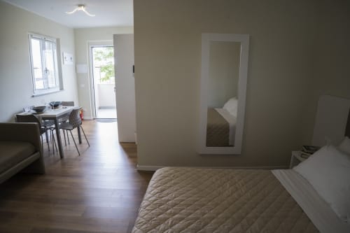 Studio apartment at Residence Balconi del Conero in Marcelli featuring bed, dining area, and sea view balcony access