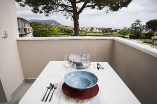Balcony dining setup at Residence Balconi del Conero in Marcelli with sea and mountain views overlooking Adriatic coast
