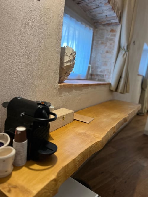 Cozy hotel room desk with coffee machine at La Cascina di Bea, Torre Boldone, overlooking city views