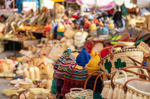 Colorful Moroccan crafts and souvenirs displayed at Riad Madinina market in Marrakech