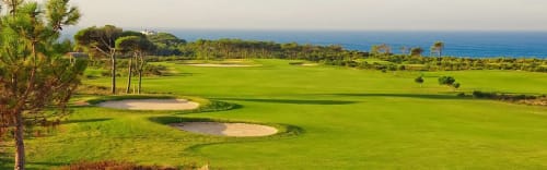 Lush golf course with ocean views at Embaixada da Vila, a coastal retreat in Cascais, Portugal