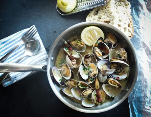Creamy clam dish in white bowl at Brooklyn House, Southgate London B&B