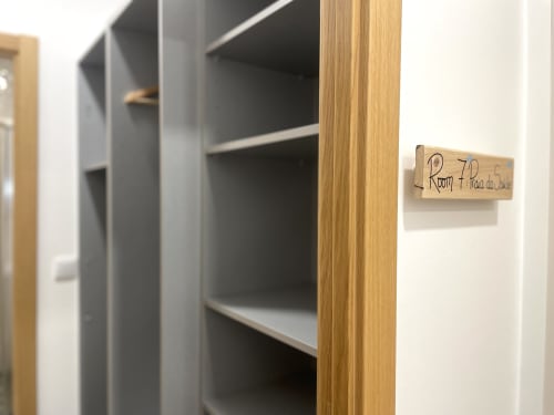 Room 7 closet with wooden frame and shelving at Vila Alexandra hostel in Costa da Caparica
