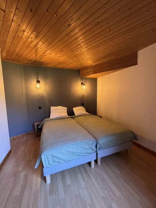 Comfortable twin room at Ardesia Morzine, ideal accommodation for a mountain stay
