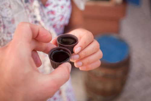 Child holding chocolate desserts at Home Alliance Bombarral guesthouse in Óbidos, Portugal