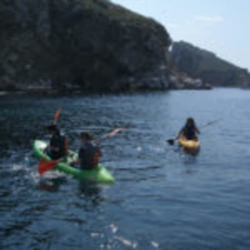 Kayaking on calm waters with dramatic cliffs at Can Gat Vell, Empordà-Catalunya