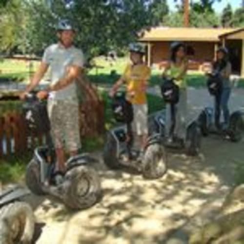 Instructor leading segway tour group at Can Gat Vell rural property in Girona, Empordà-Catalunya