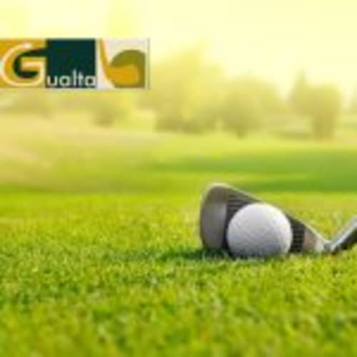 Golf club and ball on green grass near Can Gat Vell hotel in Girona