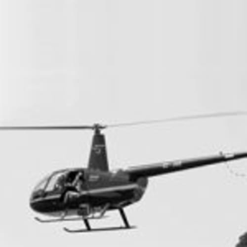 Helicopter flying near Can Gat Vell, a bed and breakfast in Girona, Empordà-Catalunya