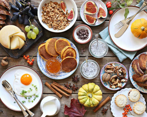 Autumn breakfast spread at Les logis de Kergoulou featuring pancakes, eggs, cheese, figs, nuts and seasonal produce