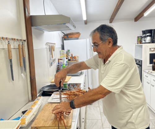 Nicola preparing fresh lobster in Les Créolines kitchen, Sainte-Luce Martinique