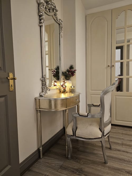 Elegant dressing area in The Liffey Suite at Dublin Exchange Suites with ornate mirror, silver vanity desk, and upholstered