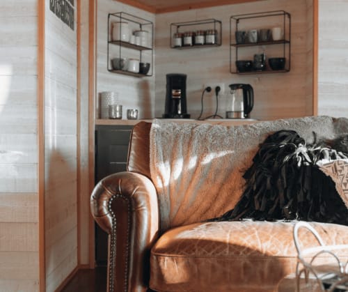 Sofa and coffee staion in the treehouse | Treehouse Holidays in France