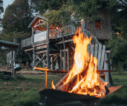 Campfire in the treehouse garden | French Treehouses for a Relaxing Getaway