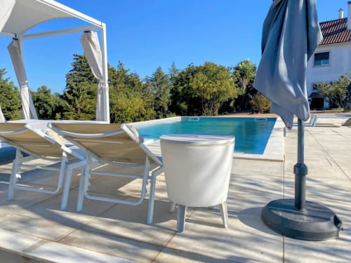 Swimming pool with sunbeds