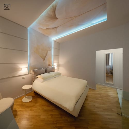 Modern Junior Suite Superior bedroom at Stella CasaBono hotel in Sulmona with illuminated headboard and wooden flooring