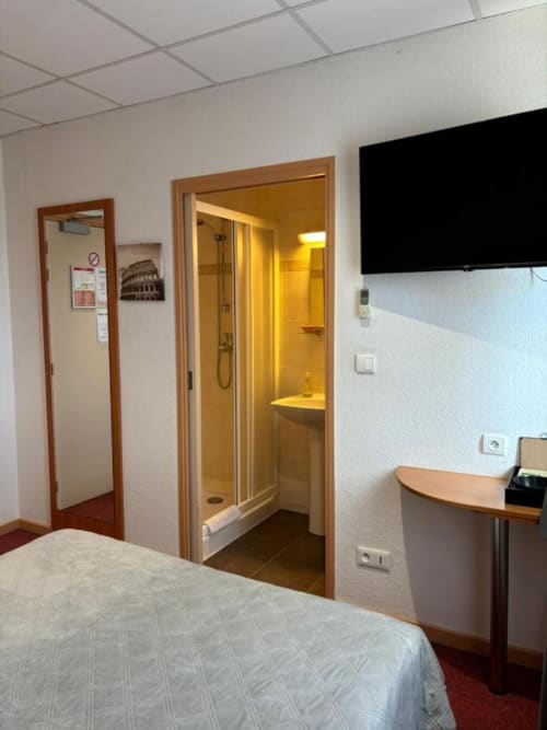 Television | Bathroom | Bed | Desk