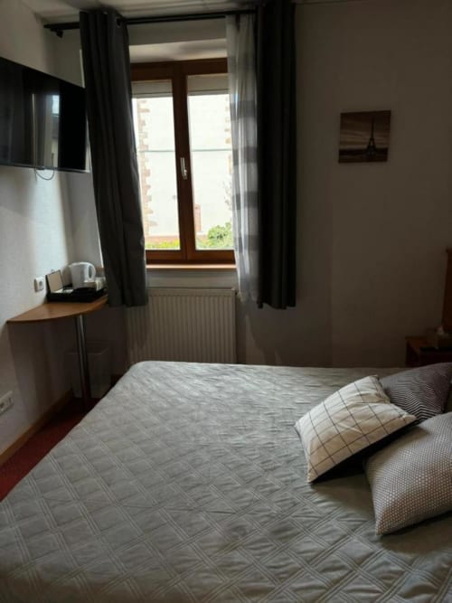 Bed | TV | Window | Curtain | Pillow