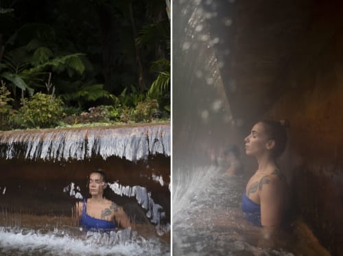 Guest enjoying natural waterfall cascade at Villa Várzea, a Portuguese bed and breakfast retreat