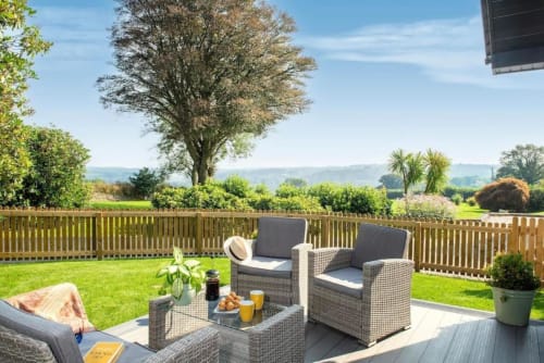Experience luxury in this holiday home near Tavistock with 1 living room, 1 bedroom, and a walk-in shower. Fully equipped kitchen, terrace with garden views, flat-screen TV, and more amenities. Max occupancy: 4.