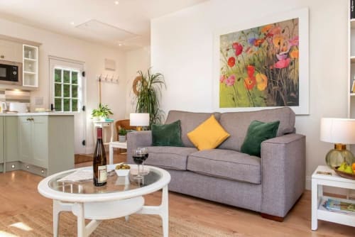 Sofa | Table | Wine | Wineglass | Lamp | Kitchen | Door | Photo