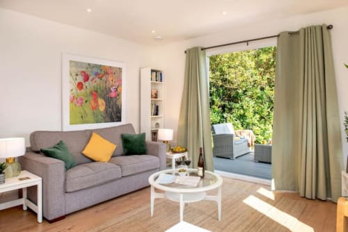 Living area | balcony | Window | Door | Sofa | Pillows | Tables and chairs | Photo