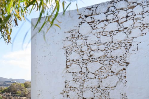 White stone wall detail at Finca de La Geria in Yaiza, showing traditional rustic architecture with natural landscape