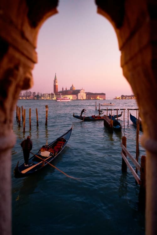 Venetian gondolas at sunset near Basilica di San Giorgio Maggiore, Sottomarina