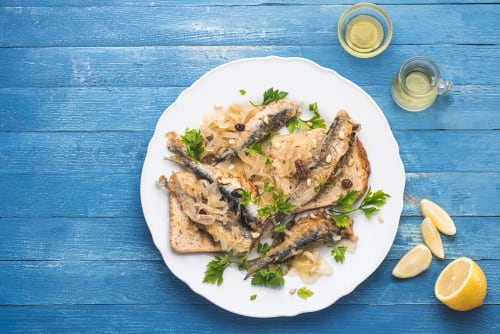 Grilled sardines with caramelized onions and fresh parsley at Residenza Sant'Antonio, Sottomarina